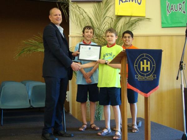   iWay Team Leader Owen Mata presents the challenge certificates to Oliver Chamberlain, Josiah Barlow and Tanmay Rege from Hastings Intermediate.
